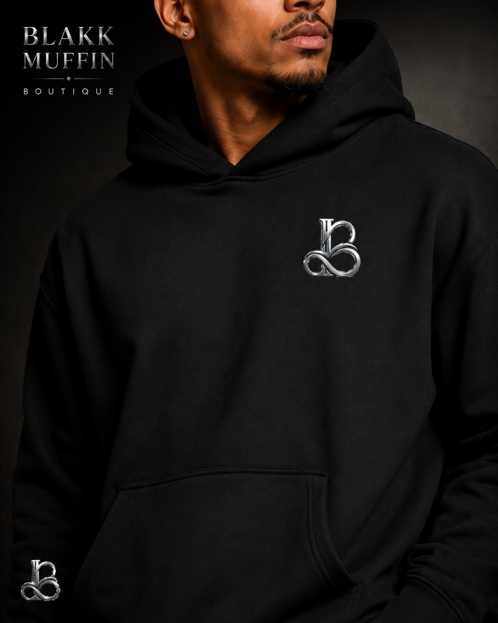 Person wearing a black hoodie with a logo, branded 'Blakk Muffin Boutique'.